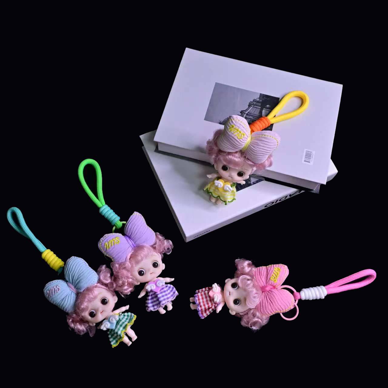 卡通立体呆萌头顶大蝴蝶结娃娃公仔挂件精品钥匙扣零钱包挂件批发详情11
