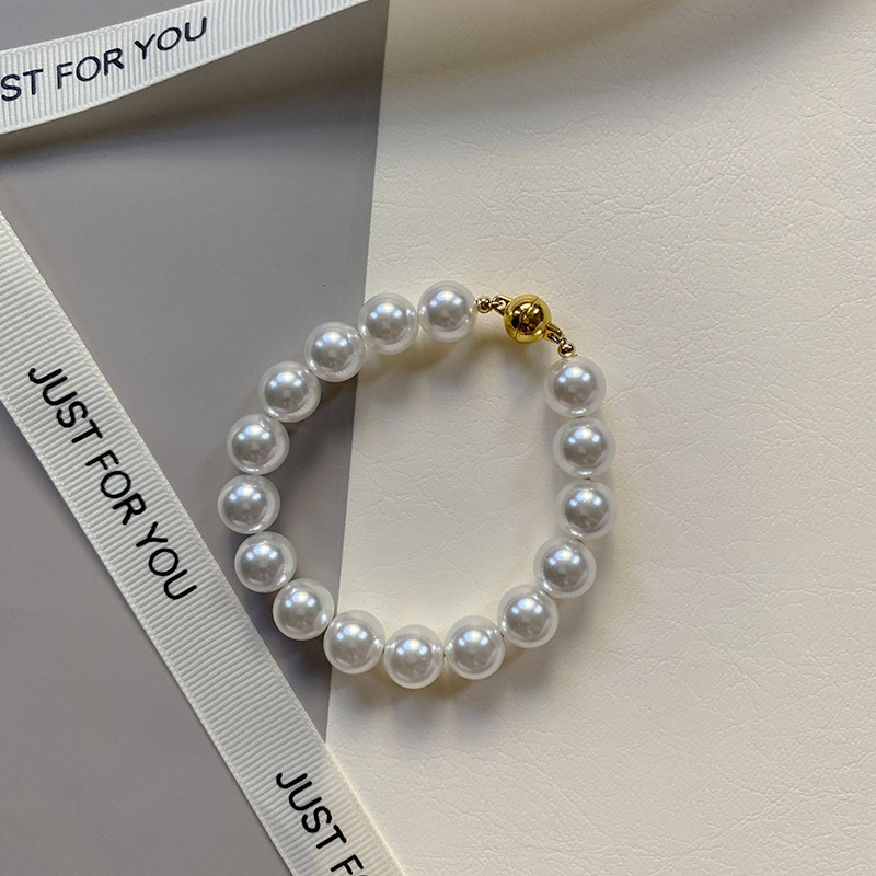 This is a trendy accessory for women, featuring a strong Australian white round magnetic pearl bracelet. It exudes a light luxury, niche and high-end vibe pic 17