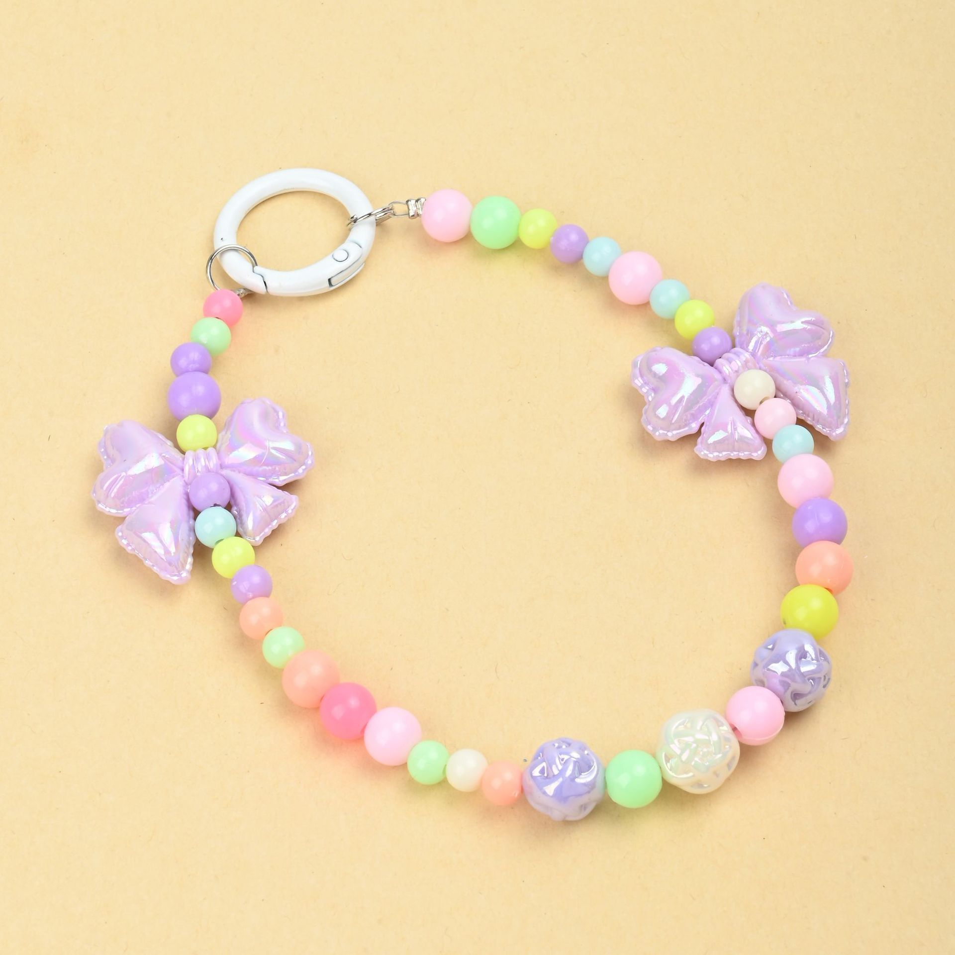 Wholesale of new colored candy-colored mobile phone chains, bows, beads, bag chains, water cup chains, car keychains and pendants pic 3