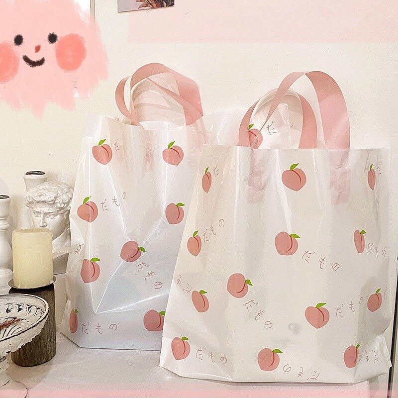 服装店袋子手提塑料袋夏日水蜜桃清新诱惑塑料购物袋化妆品袋包邮详情6