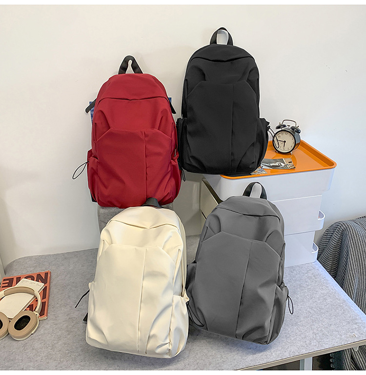 跨境新款休闲双肩包大容量简约潮酷电脑背包男女中大学生纯色书包详情11