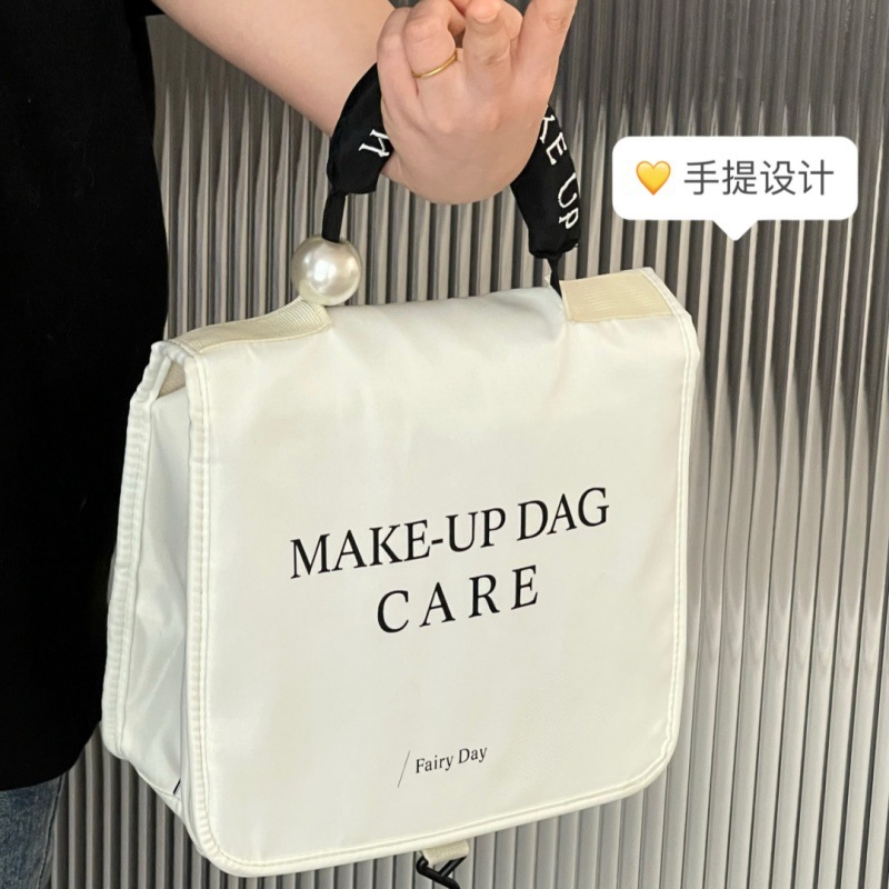 手提带珍珠化妆包防水多功能洗漱用品收纳袋户外浴室挂钩洗漱包详情4