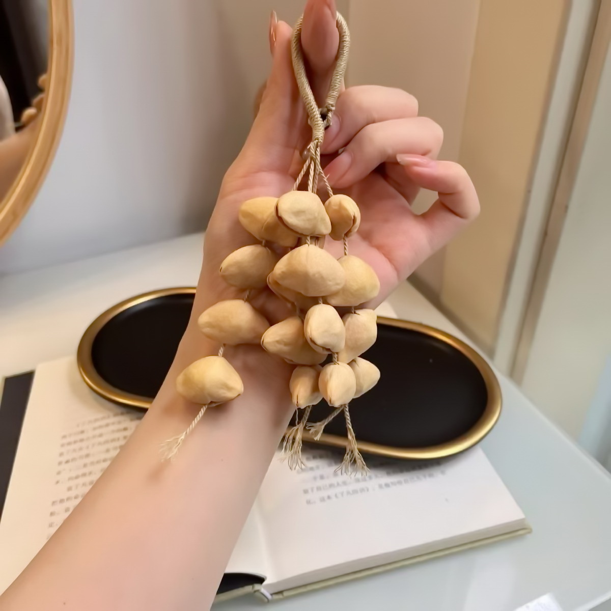 Fruit shell bell, hand-cranked bell, wind chime bag, handcrafted sound beam, bell pendant, wholesale from Indonesian black fruit shell factory pic 1