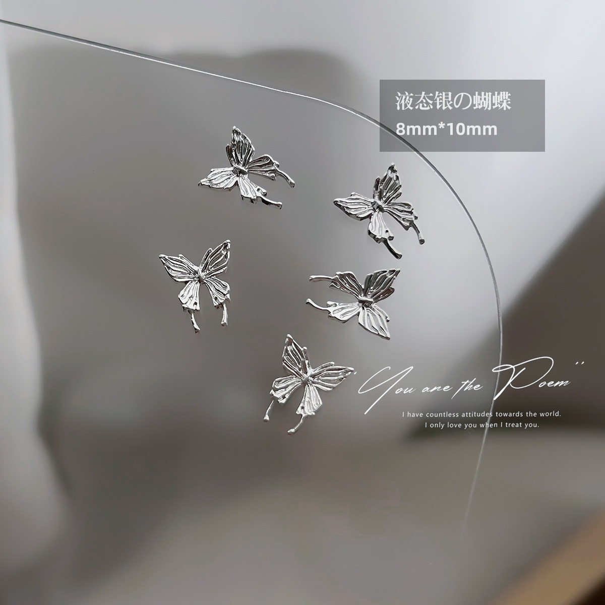 Wholesale of y2k liquid silver alloy butterfly wing hollowed-out mini bow tie nail accessories pic 11