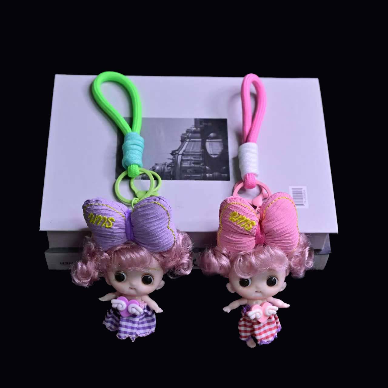 卡通立体呆萌头顶大蝴蝶结娃娃公仔挂件精品钥匙扣零钱包挂件批发详情9