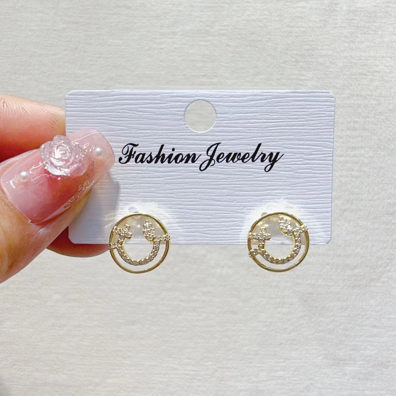 The trendy, light luxury, fresh smiley face, leaf, copper plated with real gold and slightly inlaid zircon, light luxury, niche design of INS ear studs pic 4