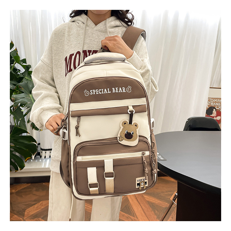 批发新款初高中学生大容量书包轻便减负背包小学生简约结实双肩包详情6