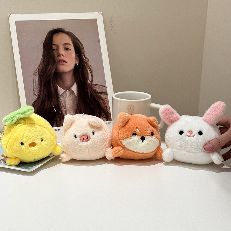 The little cat doll that wags its tail by pulling a rope is called the popular little white rabbit plush toy backpack doll at the street stall pic 11