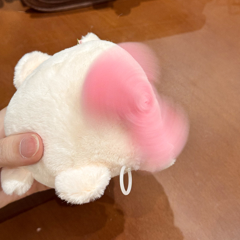 The little cat doll that wags its tail by pulling a rope is called the popular little white rabbit plush toy backpack doll at the street stall pic 8