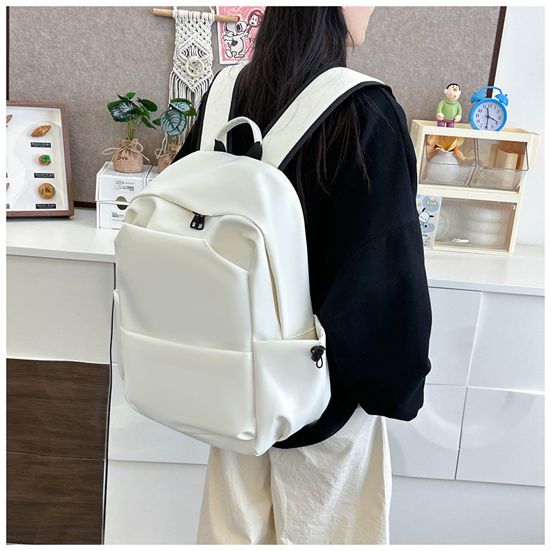New large-capacity solid color backpacks for girls in foreign trade, simple and elegant school bags for junior and senior high school students pic 19