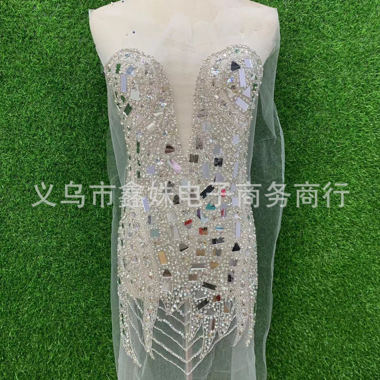 The new deep V wedding dress features heavy handcrafted mirror stitching, beaded mesh and applique pic 2