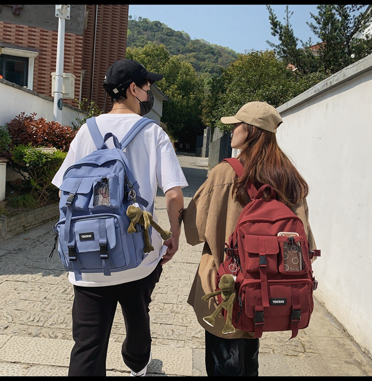 休闲百搭男女双肩包可爱挂件洋气潮流学生书包大容量工装风背包详情7