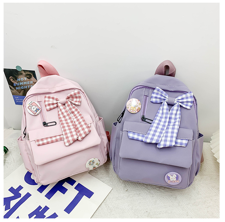 蝴蝶结书包女小学生大容量三到六年级初中轻便减负可爱简约双肩包详情8