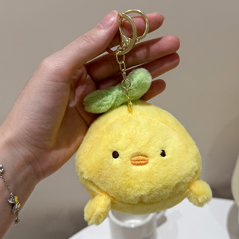 The little cat doll that wags its tail by pulling a rope is called the popular little white rabbit plush toy backpack doll at the street stall pic 4