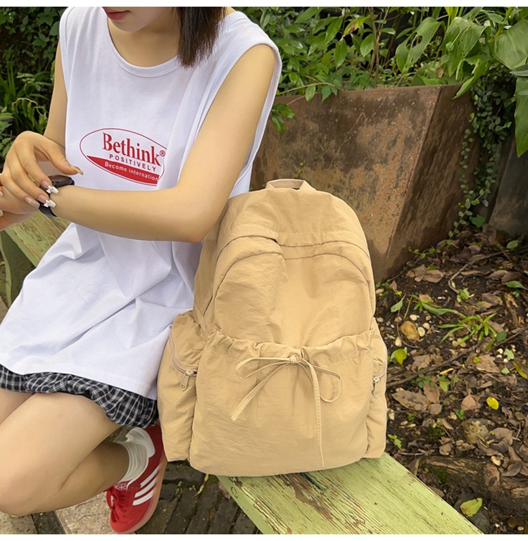 新款时尚轻便简约双肩包女日系文艺学生书包休闲运动旅行纯色背包详情12