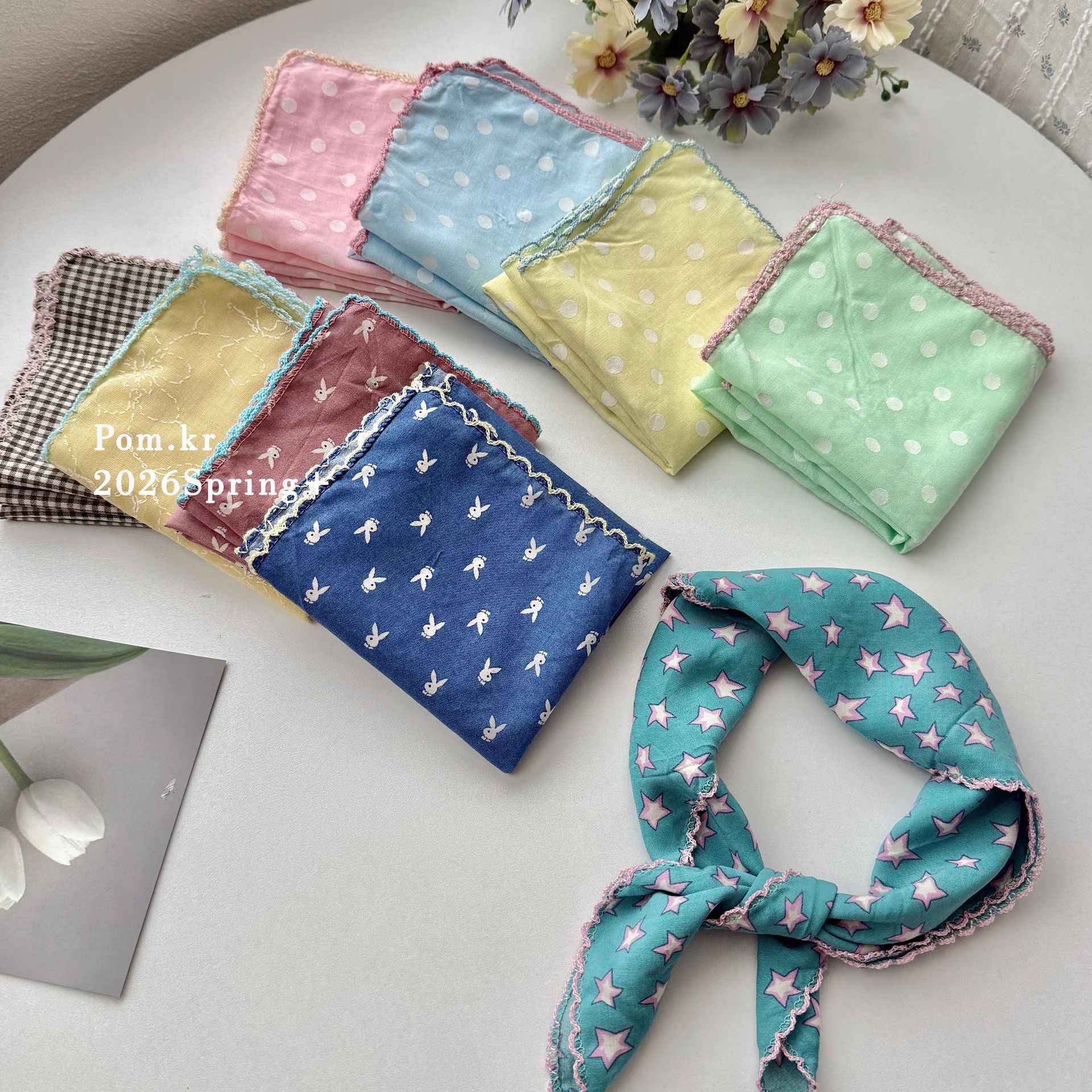 The new spring polka dot printed silk scarf is sweet and versatile. It is a neckband accessory that exudes a sense of elegance and sophistication for young girls. It is a thin and niche square scarf for women pic 3
