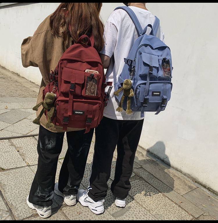 休闲百搭男女双肩包可爱挂件洋气潮流学生书包大容量工装风背包详情6