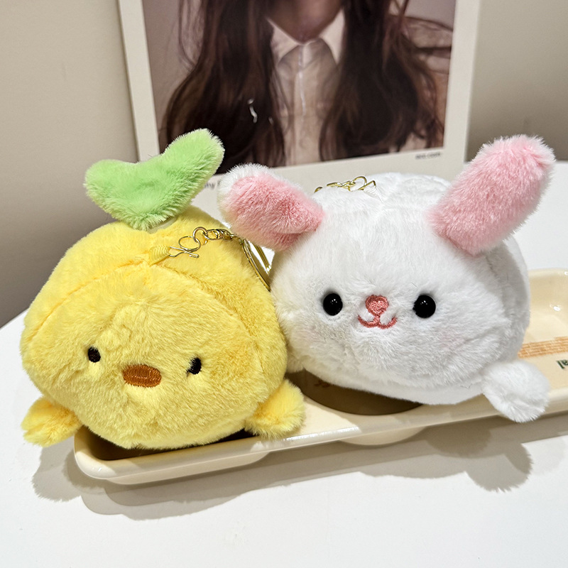 The little cat doll that wags its tail by pulling a rope is called the popular little white rabbit plush toy backpack doll at the street stall pic 13