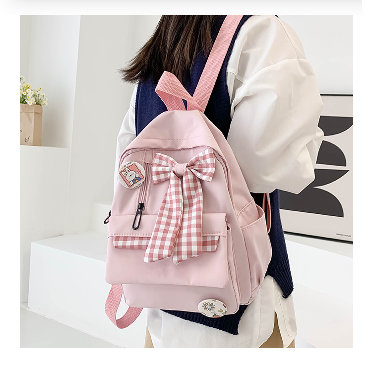 蝴蝶结书包女小学生大容量三到六年级初中轻便减负可爱简约双肩包详情3