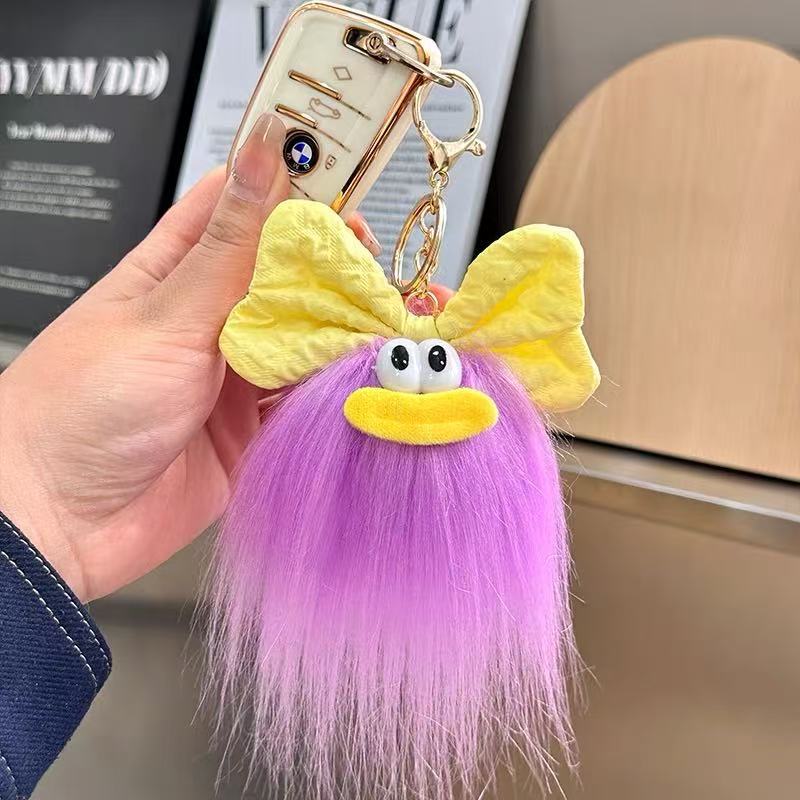 可爱蝴蝶结怪兽娃娃钥匙扣卡通搞怪毛绒书包挂件丑萌玩偶挂饰礼品详情9