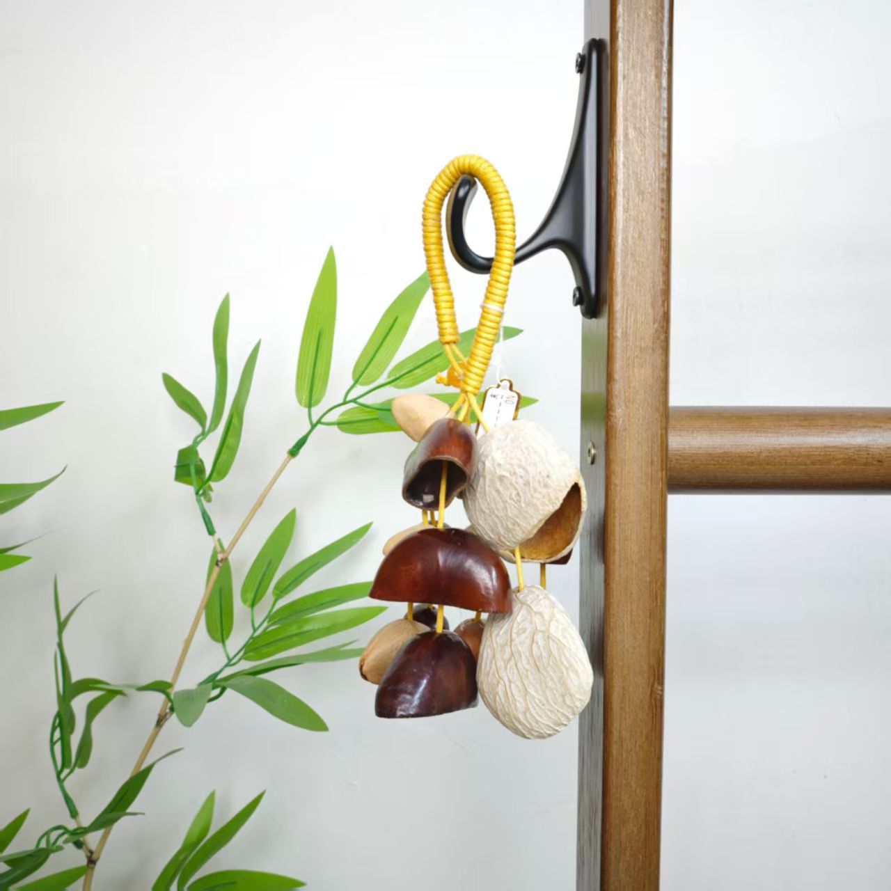 Fruit shell bell, hand-cranked bell, wind chime bag, handcrafted sound beam, bell pendant, wholesale from Indonesian black fruit shell factory pic 4