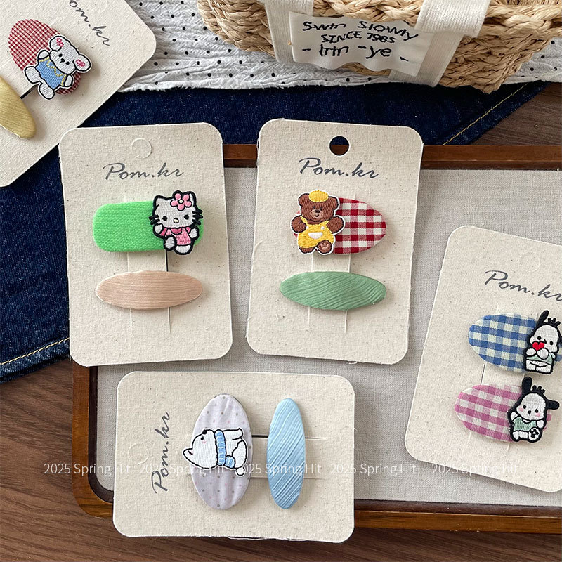 New Korean-style children's fabric cartoon hair clip with checkered oval bangs and side tousled hair, a girl's bye-bye hair clip accessory