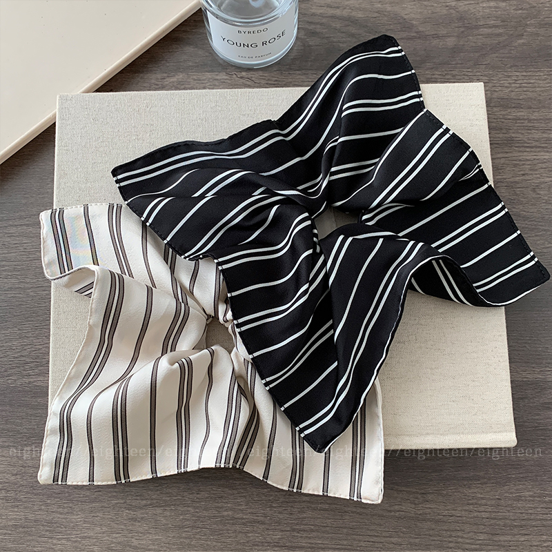 A super large beige striped square scarf with a large hair tie for women, exuding a sense of sophistication and elegance. It features a square hair accessory and a hair tie details Picture