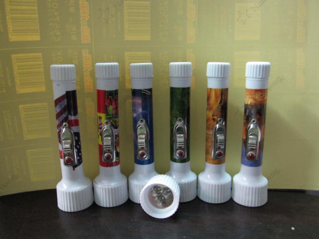 Pocket-sized plastic flashlight, Obama animal football star building, euro dollar printed export to Africa, 2AA battery details Picture
