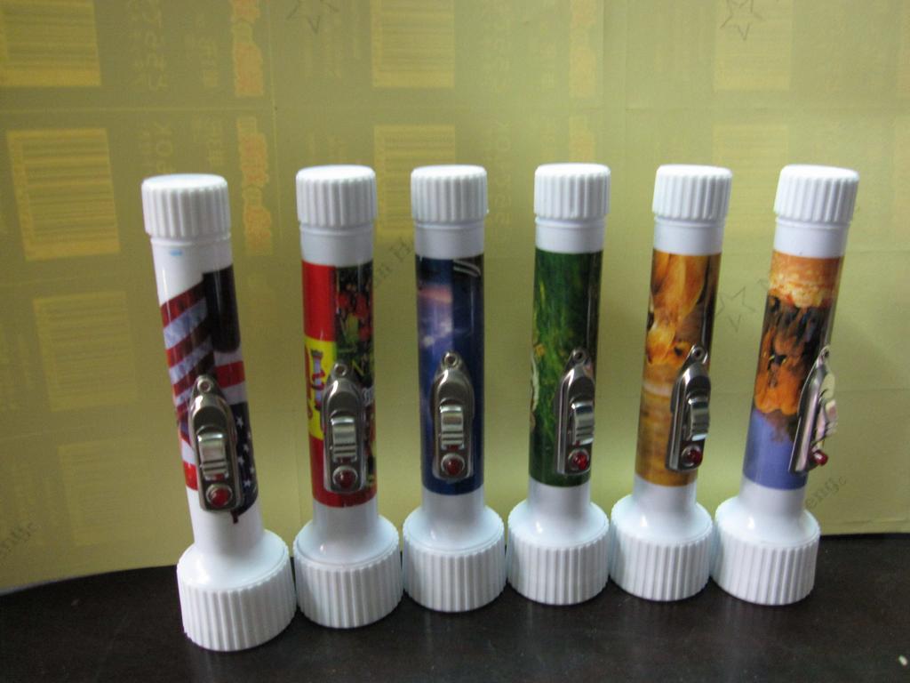 Pocket-sized plastic flashlight, Obama animal football star building, euro dollar printed export to Africa, 2AA battery