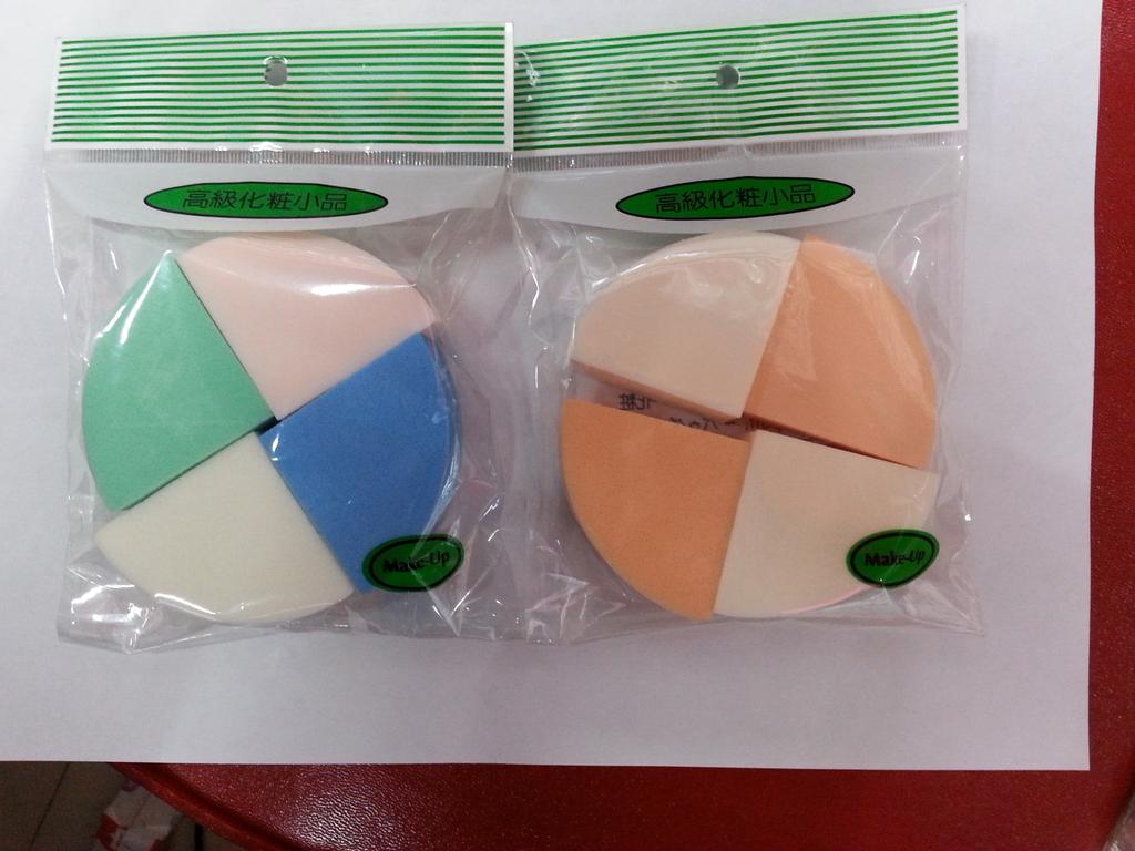 Four round powder puffs