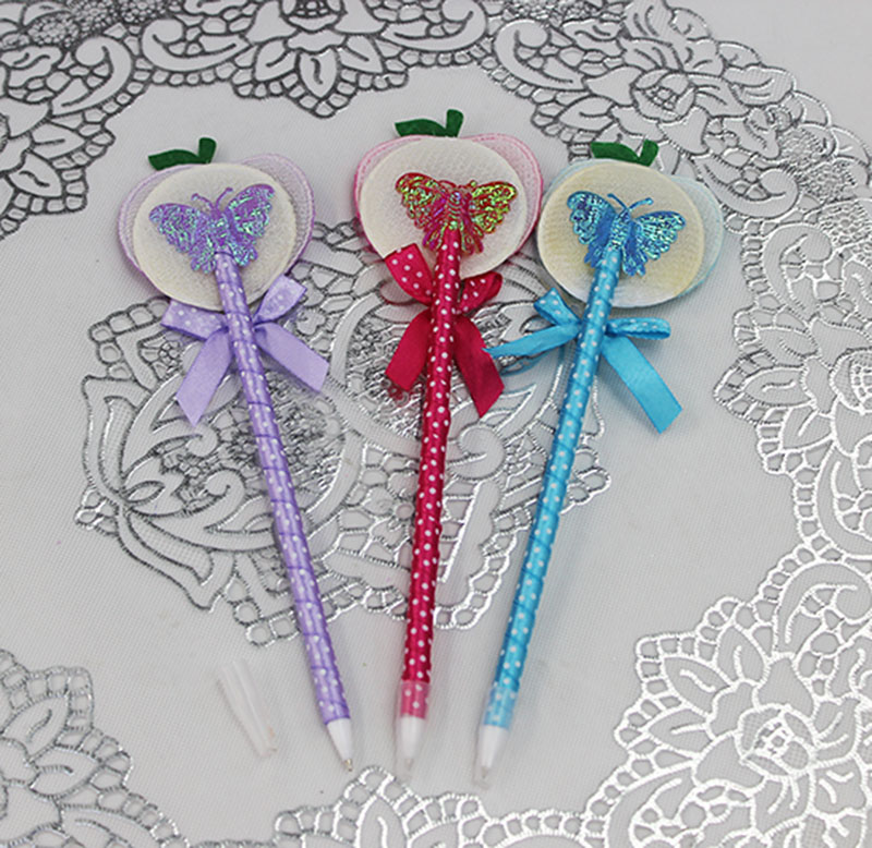 Wholesale of the new Korean version stationery in four colors: cute apple doll ballpoint pen and plush doll pen details Picture