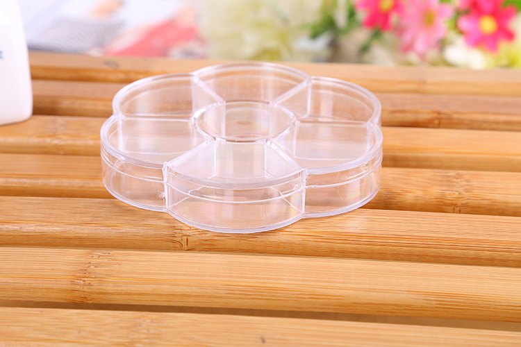 Wholesale of creative home storage plum blossom 7-compartment storage boxes, jewelry, medicine boxes, beaded components and parts boxes Application Scenario
