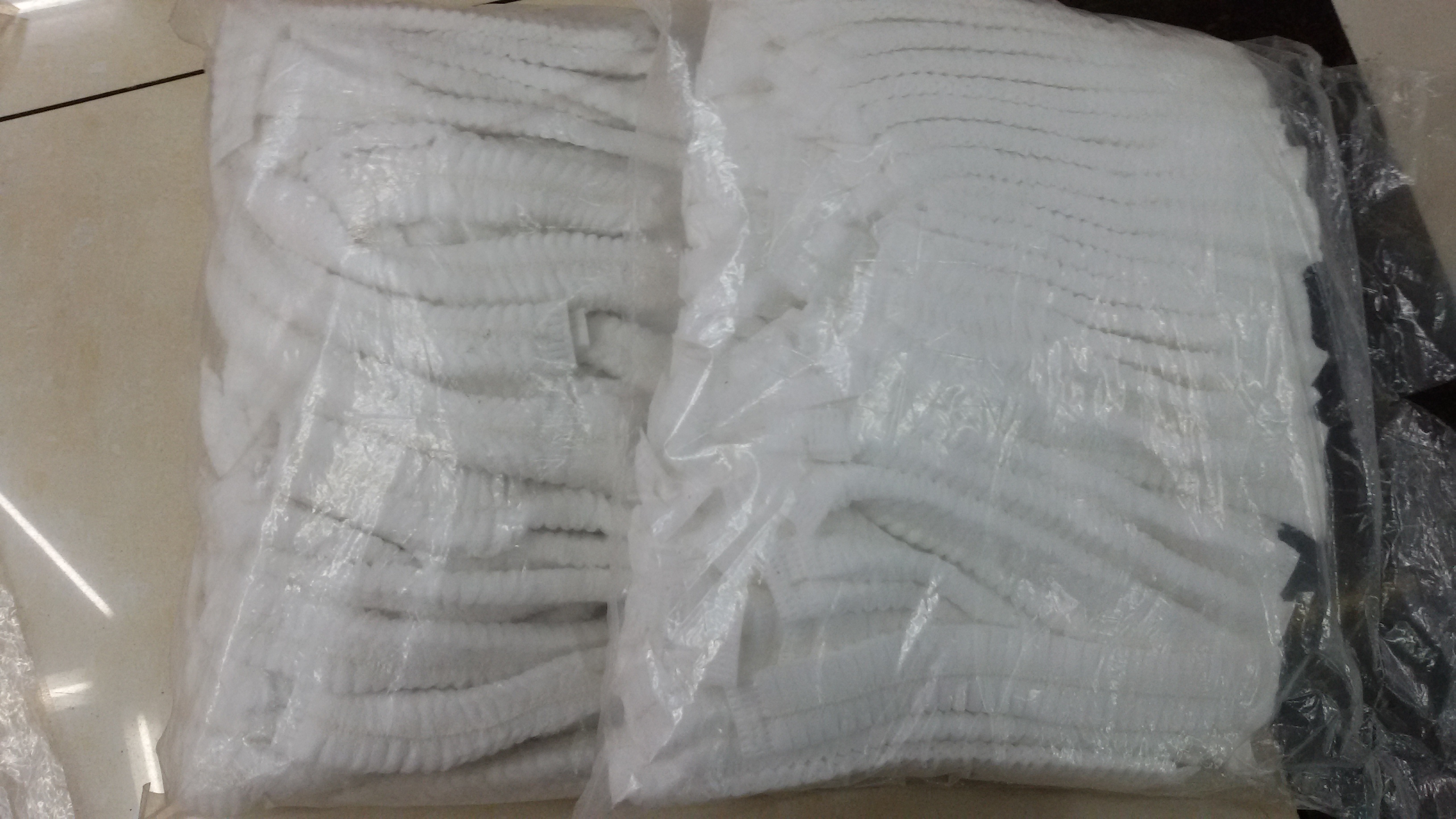 Disposable non - woven strip cap - bath cap