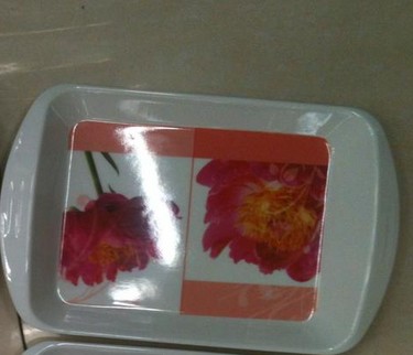 Small tray used as makeup organizer with lipsticks and brushes