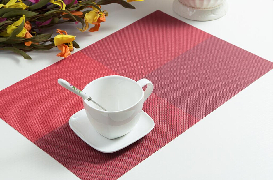 The hotel placemats feature red square grids