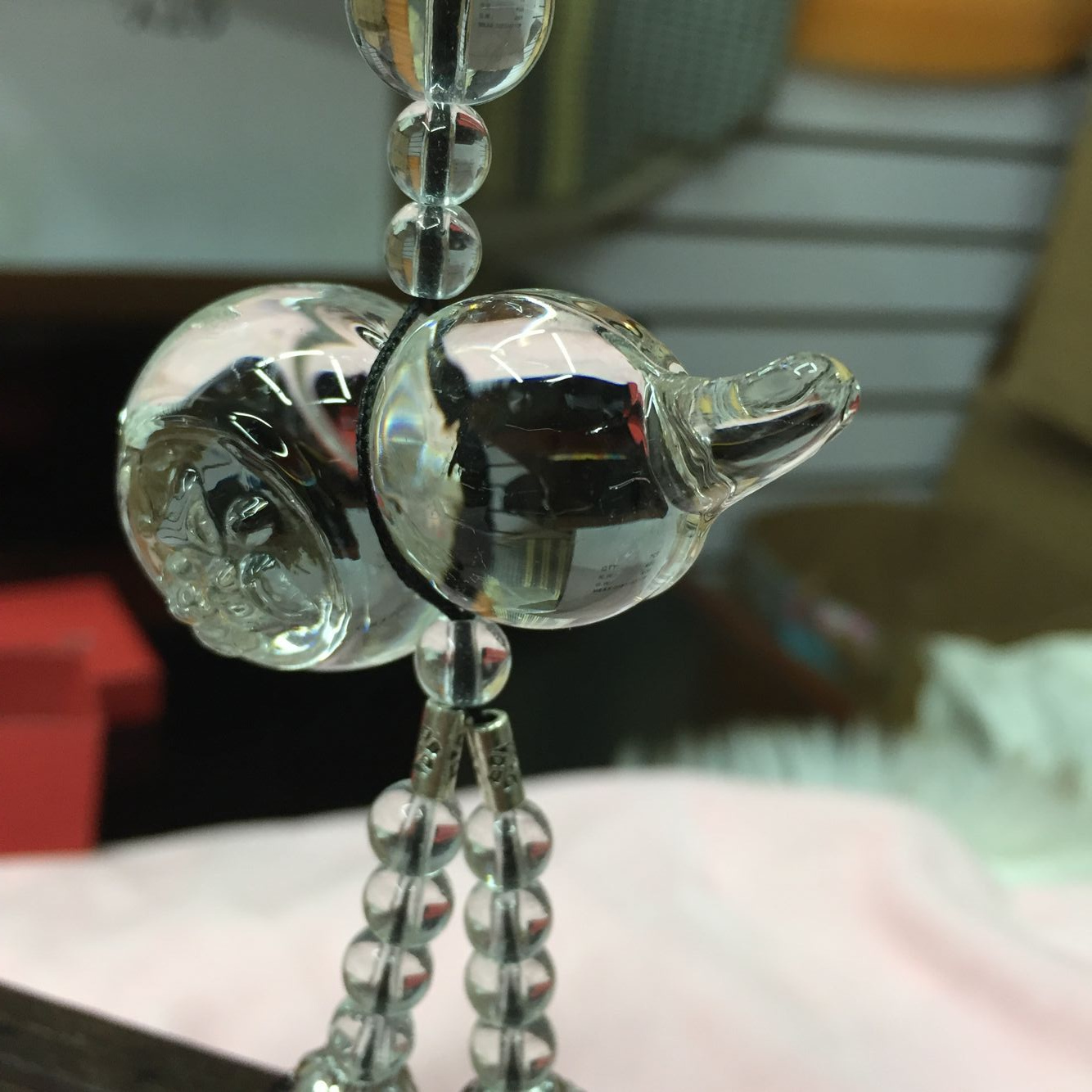 A crystal frosted gourd with water drops is hung on a car Application Scenario