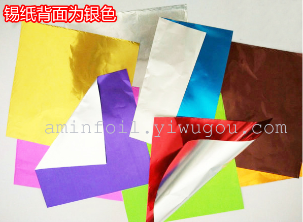 Assorted colorful aluminum foil sheets arranged in a gradient