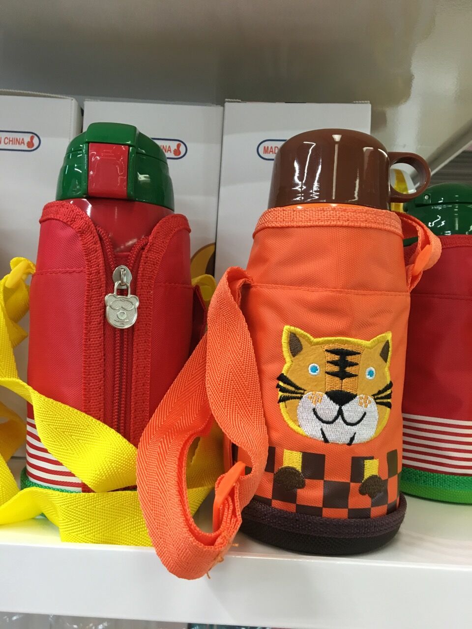 A Child's vacuum insulated kettle with two covers. Carry a warm water glass on your back. Cartoon children's pot thumbnail