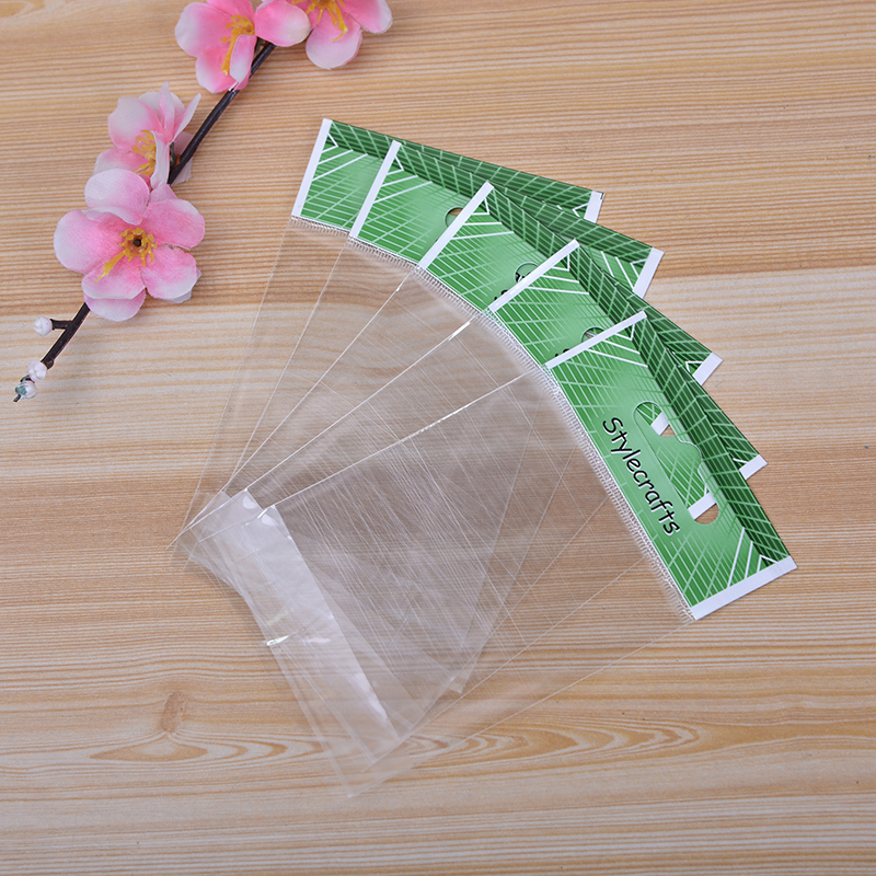 厂家批发双层OP卡头珠光膜绿色英文袋 透明塑料包装袋 自粘袋