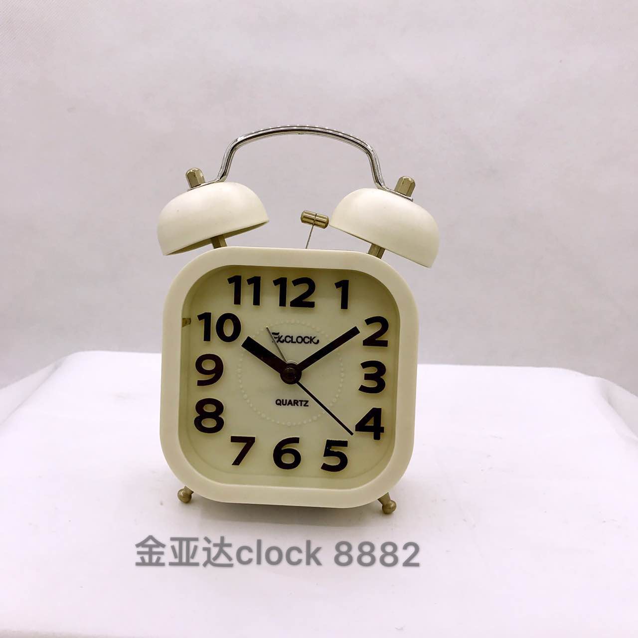 A small alarm clock with raised lettering details Picture