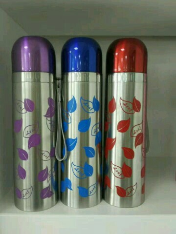 Vacuum insulated travel cup