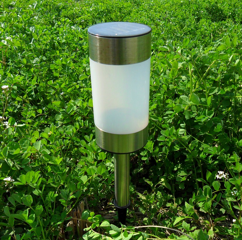Outdoor solar-powered yard lights with ground cannonballs full figure