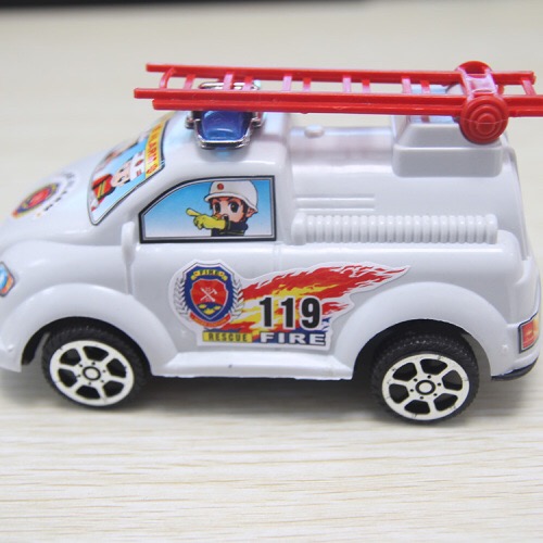 A fire engine with a pull wire, toys at a street stall details Picture