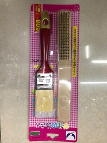 Brush with paint, brush with red handle, brush with bristles, wire brush
