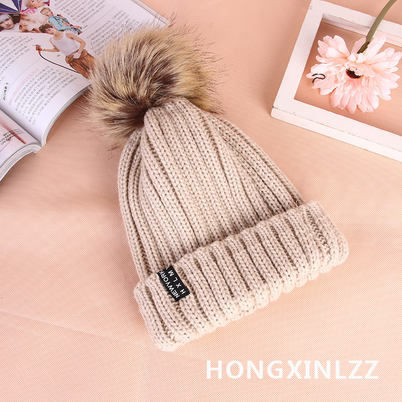 Wholesale of new Korean style autumn and winter thickened woolen caps for women with rolled edges and fashionable wool balls details Picture