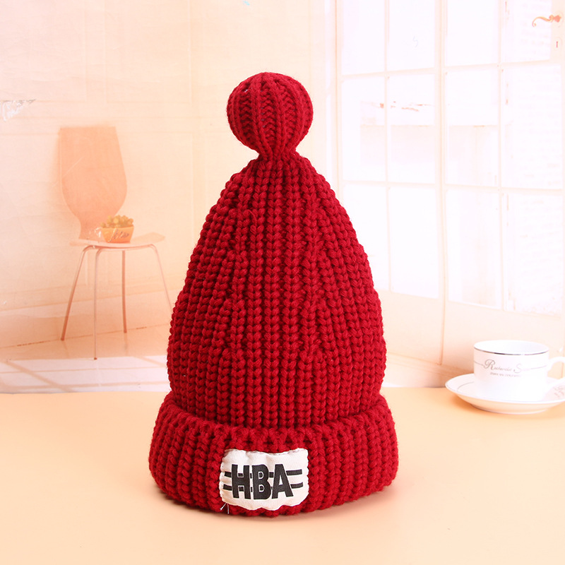 Solid color pointed warm thickened Korean version autumn and winter pacifier wool knitted cap accessories in stock, female style and student wholesale