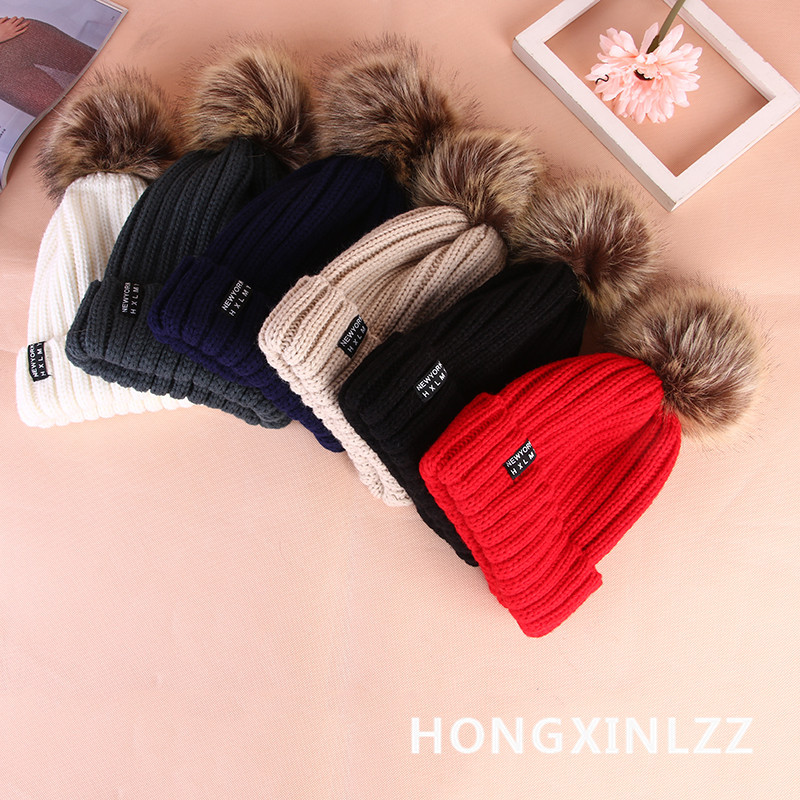 Wholesale of new Korean style autumn and winter thickened woolen caps for women with rolled edges and fashionable wool balls