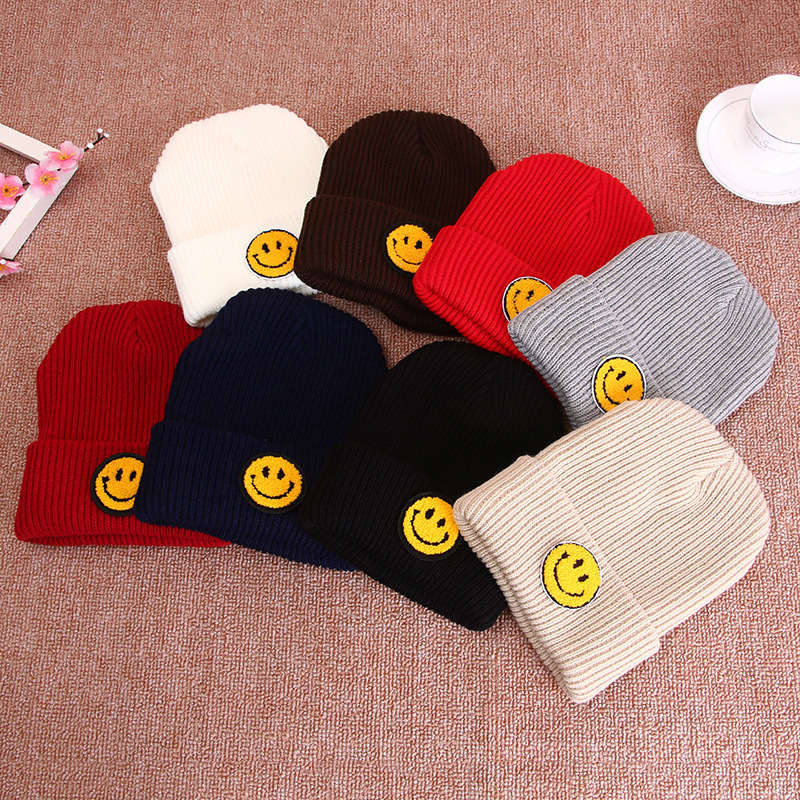 Woolen hats, thick pullover caps for both men and women, with flanged smiling faces and labels, wholesale for students