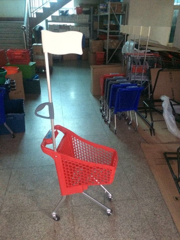All plastic children's trolley with flag shopping cart