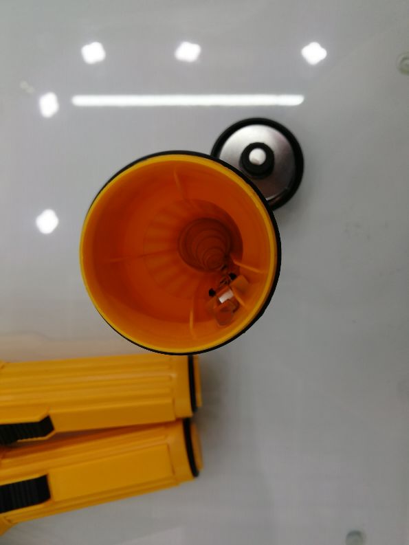The old plastic yellow flashlight with a yellow bulb details Picture
